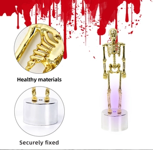 Detailed view of golden skeleton figure with LED glowing base for Halloween decoration