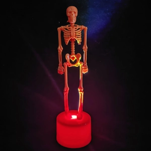 Detail of LED glowing skeleton figure with red light base for Halloween decor