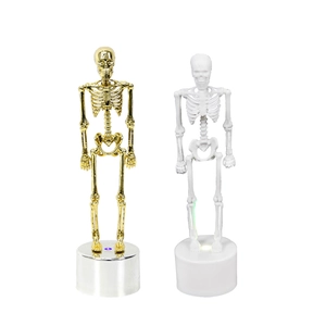 Halloween glowing skeleton ornaments set in gold and white with LED base for desk decor