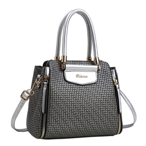 Textured handbag with gray geometric prints and silver trim shown in a front view