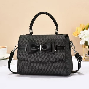 Elegant dark grey woven crossbody bag with black leather bow and silver metal clasp