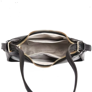 Interior view of black pebbled leather underarm bag with herringbone lining and pockets