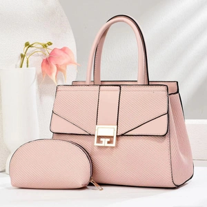 Close-up of pink woven texture handbag set with gold buckle and matching coin purse