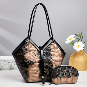 Detailed view of 3-piece set featuring textured animal print tote and matching bags
