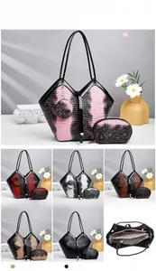 Detailed view of women's crocodile embossed tote bag set with interior pouch and colors