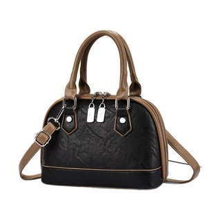 Retro black and brown shell crossbody bag with adjustable strap and silver hardware