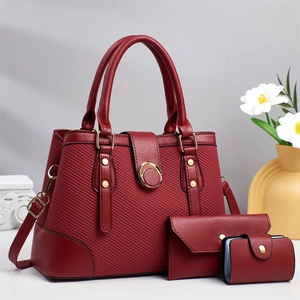 Three-piece burgundy striped tote set with handbag and card holder in premium synthetic leather