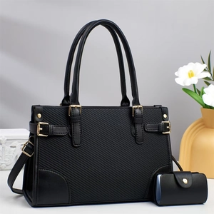Elegant black textured PU leather handbag with top handle and matching card holder pouch