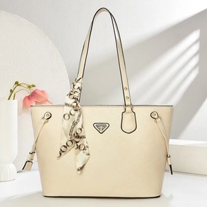 Elegant beige faux leather tote bag with silk scarf handle and metal logo detail