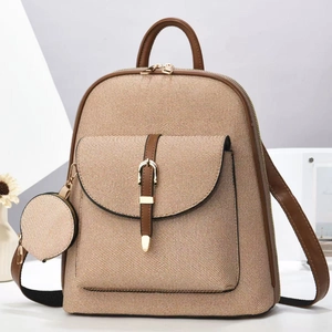 Women's twill weave backpack with brown leather trim and matching round coin purse