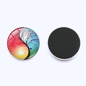 Detail view of Tree of Life glass fridge magnet showing decorative front and magnetic back