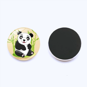 Detailed view of round panda fridge magnet with glass dome and magnetic backing