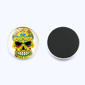 Detailed view of 25mm glass sugar skull fridge magnet with strong magnetic backing