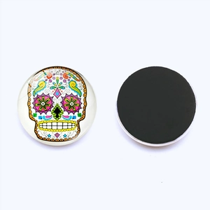 Front and back detail of 25mm sugar skull glass magnet with black magnetic backing