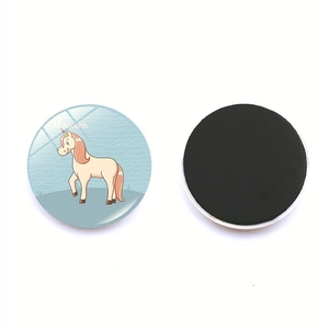 Round magnetic fridge magnet featuring a cute unicorn illustration on light blue background