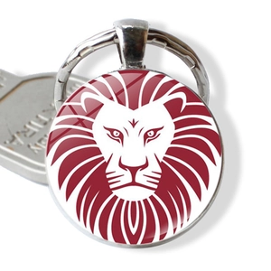 Lion head silhouette keychain with red emblem and polished silver metal ring