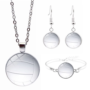 Close-up of silver volleyball jewelry set including necklace, earrings, and bracelet