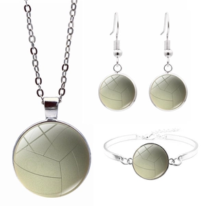 Detailed four-piece volleyball jewelry set featuring necklace, earrings, and bracelet