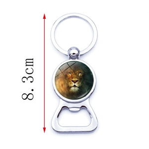 Metal lion head glass bottle opener keychain measuring 8.3cm in length on white background