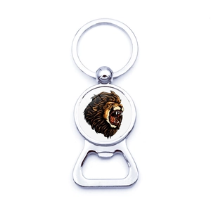 Detail showing a silver lion head bottle opener keychain with a metallic ring pendant