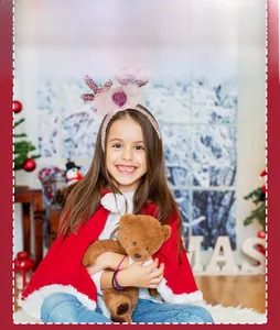 Detail of pink Christmas headband with sequined antlers and heart on a festive model