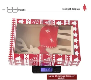 Detailed view of wool felt Christmas elk ornament in packaging weighing 145.8g on a scale
