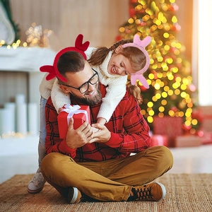 Close-up of festive plush reindeer antlers and rabbit ear headbands for Christmas party decor