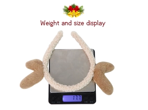 Detailed view of the 17.7g plush Christmas reindeer antler headband on a digital scale