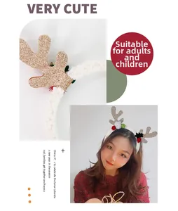 Detail of plush Christmas reindeer headband with gold glitter antlers and fuzzy balls