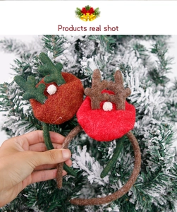 Detail of plush reindeer antler headbands with soft pom-poms for Christmas parties