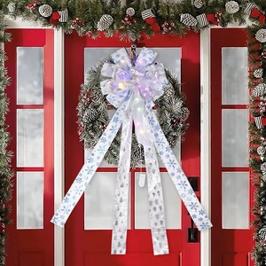 LED lighted Christmas tree topper bow with snowflake pattern and Merry Christmas text