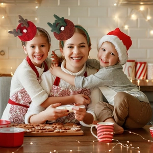 Plush Christmas reindeer antler headbands for kids and adults in festive home kitchen setting