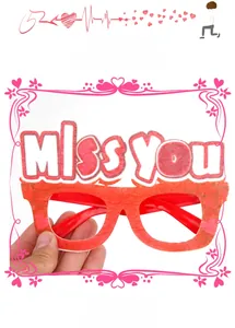 Detail shot of red Miss You party glasses for Valentine's Day photo booth props