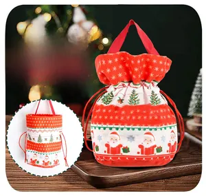 Detailed view of velvet Christmas drawstring candy bag with Santa Claus and tree prints