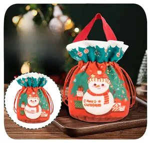 Detailed view of red Christmas snowman gift bag with dimensions 27cm x 12cm
