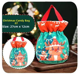 Detail view of a green Christmas reindeer gift bag with handles measuring 27cm by 12cm