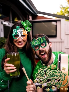 Close-up of St. Patrick's Day party glasses with green clover and shamrock designs