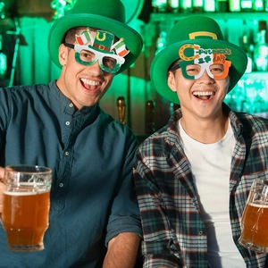 St. Patrick's Day shamrock glasses set worn by men in a pub for festive party parade