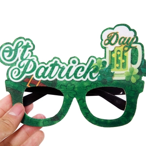 Green St. Patrick's Day party glasses with shamrock and beer mug decorations