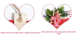 Detail of sturdy jute rope mounting and rustic plaid bow decoration on wooden heart sign