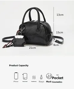 Dimensions détaillées du sac à main noir avec indication de capacité pour objets quotidiens