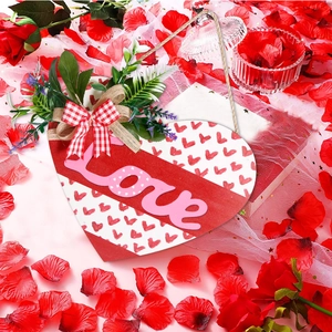 Wooden heart-shaped Valentines door sign with Love text and floral bow decoration