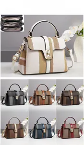 Three-layer interior compartment of a color-block canvas and PU leather handbag