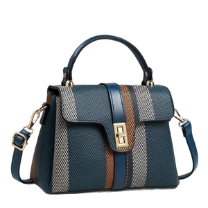 Fashion color-block canvas handbag with striped texture and golden rotating buckle
