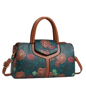 Floral embossed Boston tote bag with brown leather straps and vintage metallic details