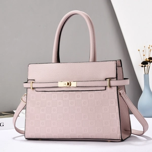 Pink textured leather handbag with gold twist lock and adjustable shoulder strap