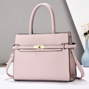 Pale pink lychee grain handbag with gold clasp and detachable shoulder strap