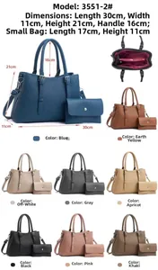 Detail view of 2-piece tote bag set interior pockets and vertical embossed leather texture