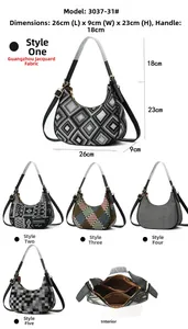 Detailed size chart for geometric canvas shoulder bag measuring 26x9x23cm with 18cm handle