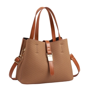 Elegant brown woven bucket bag with leather handles and gold metal hardware for women